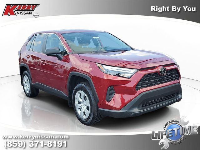 2023 Toyota RAV4 LE in Ruby Flare Pearl — front three-quarter view